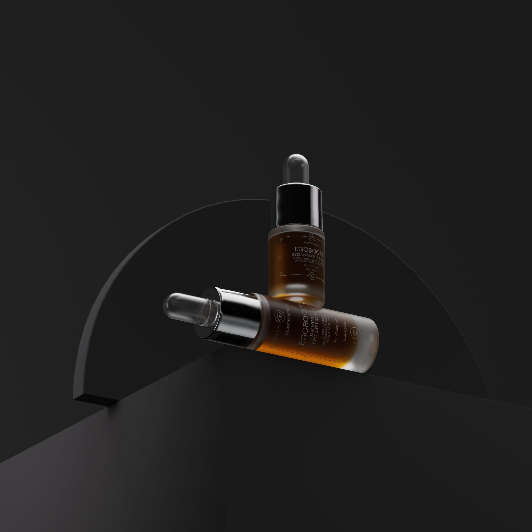 Supermood Egoboost serums artfully balanced on a rugged black stone surface, exuding luxury skincare.